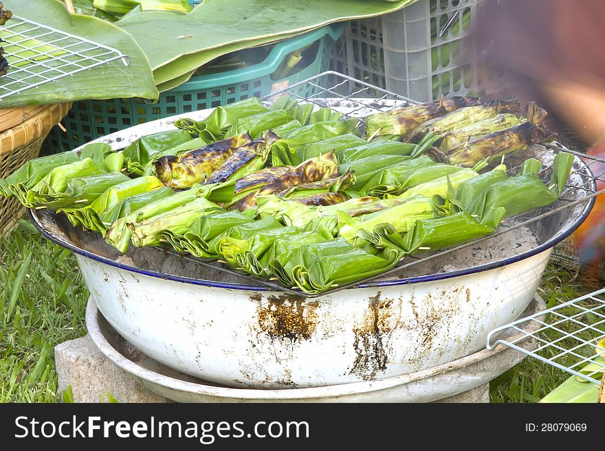 After baking is native Thailand. Wrapped in banana leaves. Put rice and bananas cooked inside. After baking is native Thailand. Wrapped in banana leaves. Put rice and bananas cooked inside.