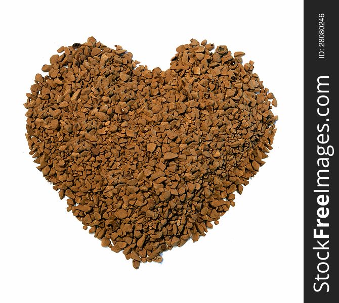 Studio macro image of a heart shape comprising 'instant' coffee granules on a white background. Copy space. Studio macro image of a heart shape comprising 'instant' coffee granules on a white background. Copy space.