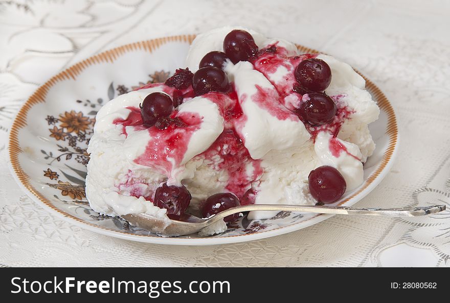 Cottage cheese with sour cream and cranberry berries for a breakfast