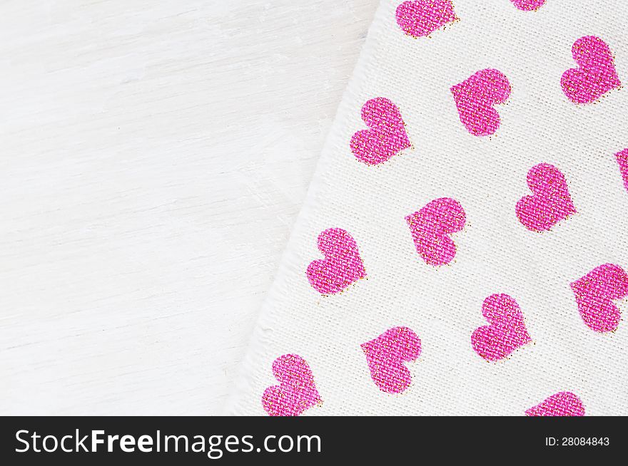 Valentines day background with pink heart shaped textile