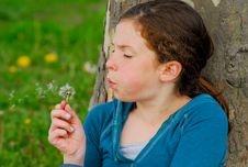 Young Girl Making A Wish. Royalty Free Stock Images Young Girl Making A Wish. Royalty Free Stock Images