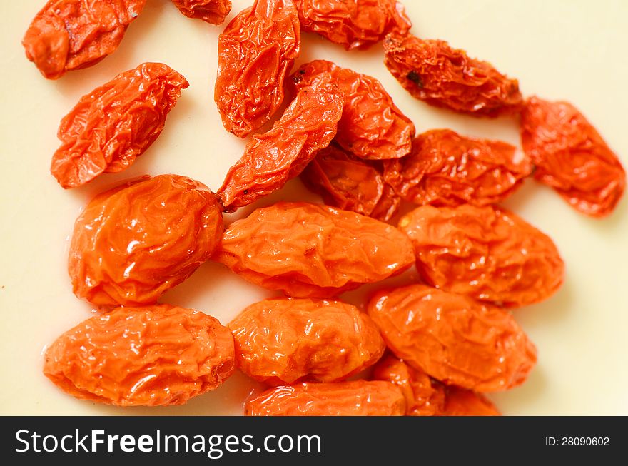 Dried Golgi Berry or Chinese Wolfberry (Lycium chinense) and some immersed in the water. Dried Golgi Berry or Chinese Wolfberry (Lycium chinense) and some immersed in the water.