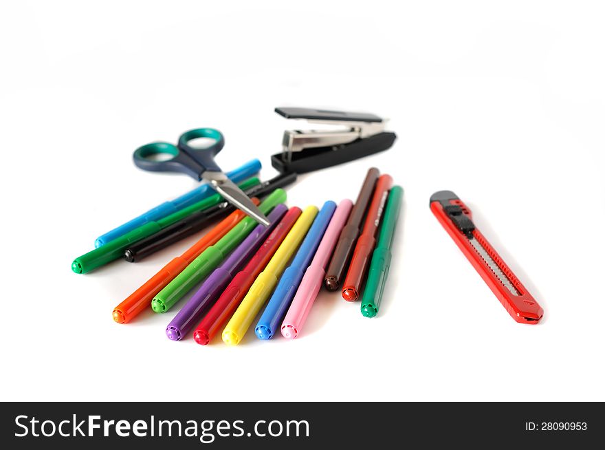 Colour pens and school stationery on white