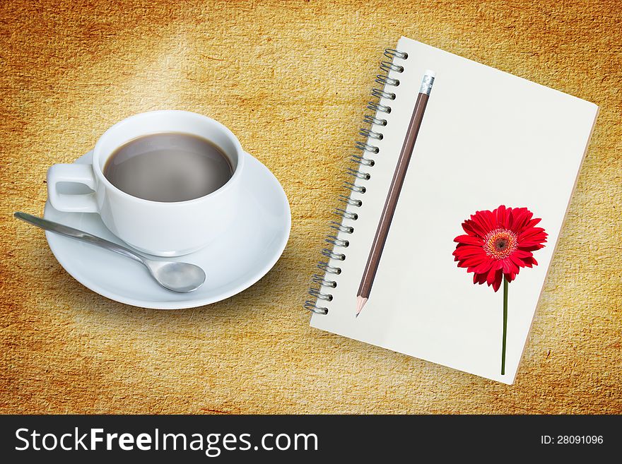 Coffee And Note Book On Grunge Background