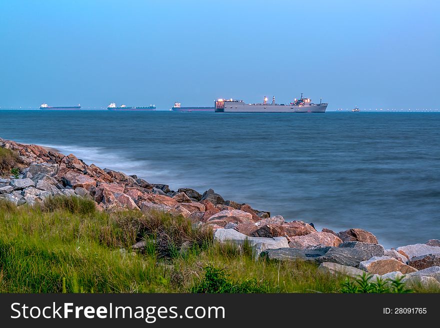 Cargo ships at anchor in Sewells Point Virgina. Located just off Virginia Beach. Shot taken a few minutes before sunrise.