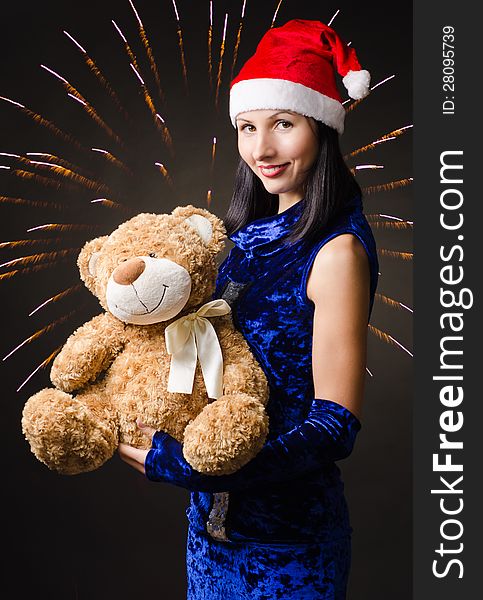 Snow maiden presents a toy bear in a gift