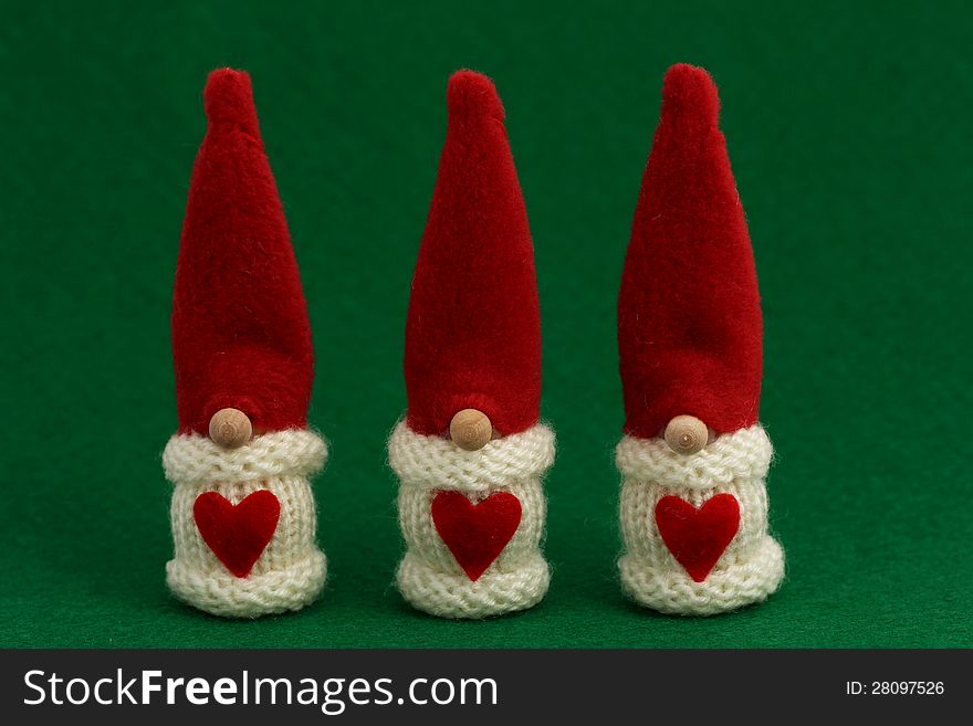 Cute three Santa's Christmas decoration on green felt. Cute three Santa's Christmas decoration on green felt