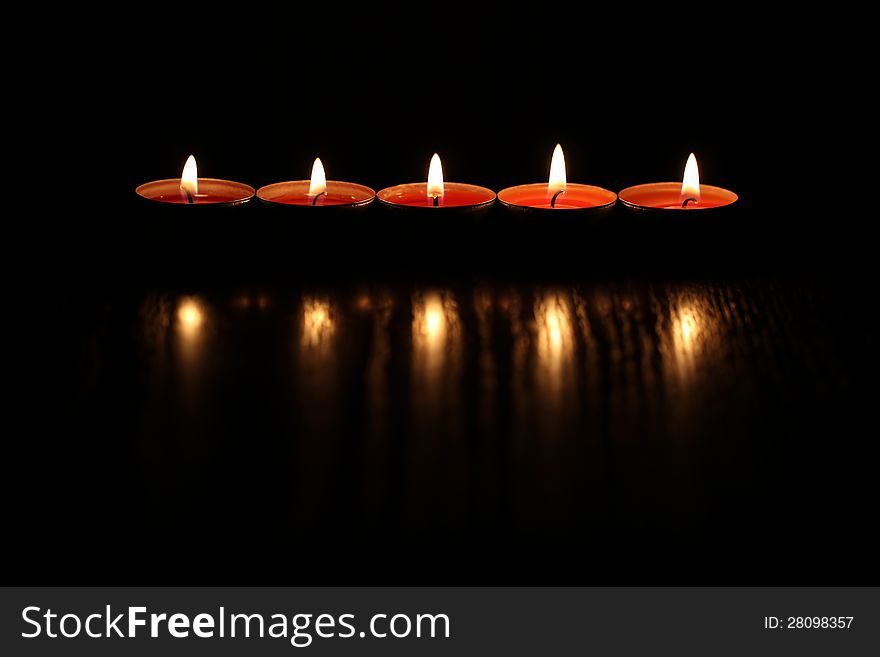 Red Christmas candles on dark background. Red Christmas candles on dark background