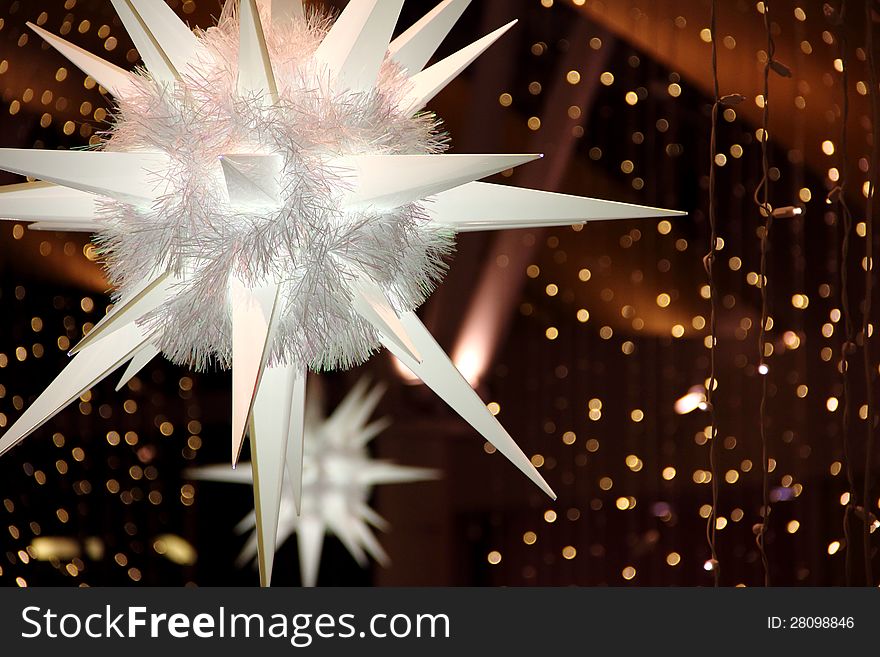 Giant Snowflakes backed by christmas lights