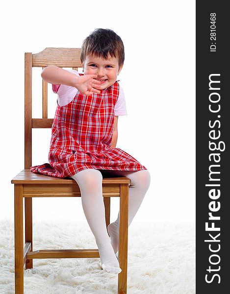 Portriat of little girl on chair