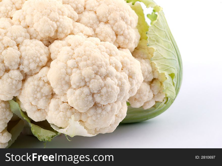 Cauliflower with leaves on white background. Cauliflower with leaves on white background