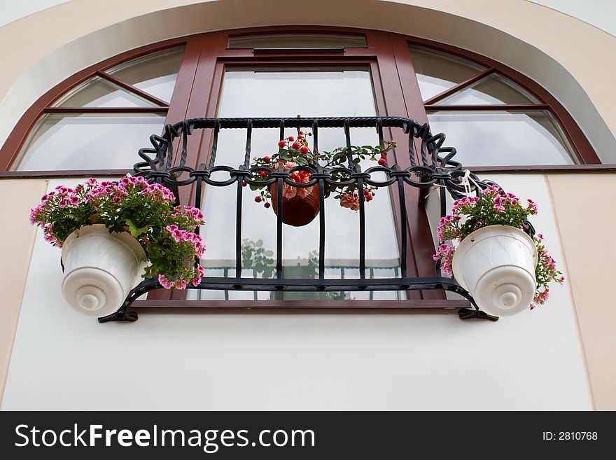 French balcony with hanging flower pots