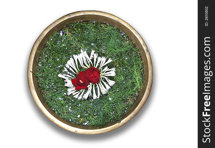 A bowl decorated with different flowers and green grass. A bowl decorated with different flowers and green grass.