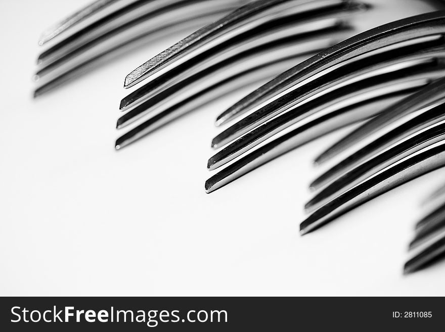 Still life of forks lined up