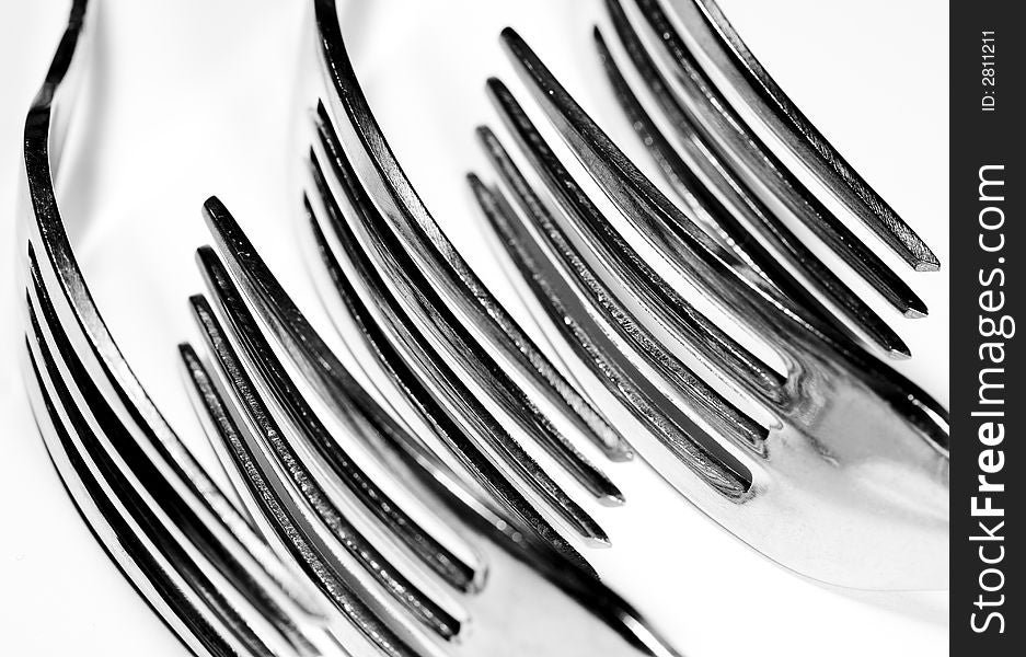 Black and white study of forks and the patterns they produce