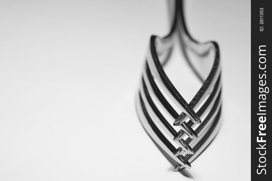 Black and white study of forks and the patterns they produce