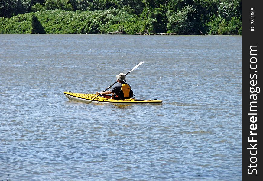 Kayaking the river in summer