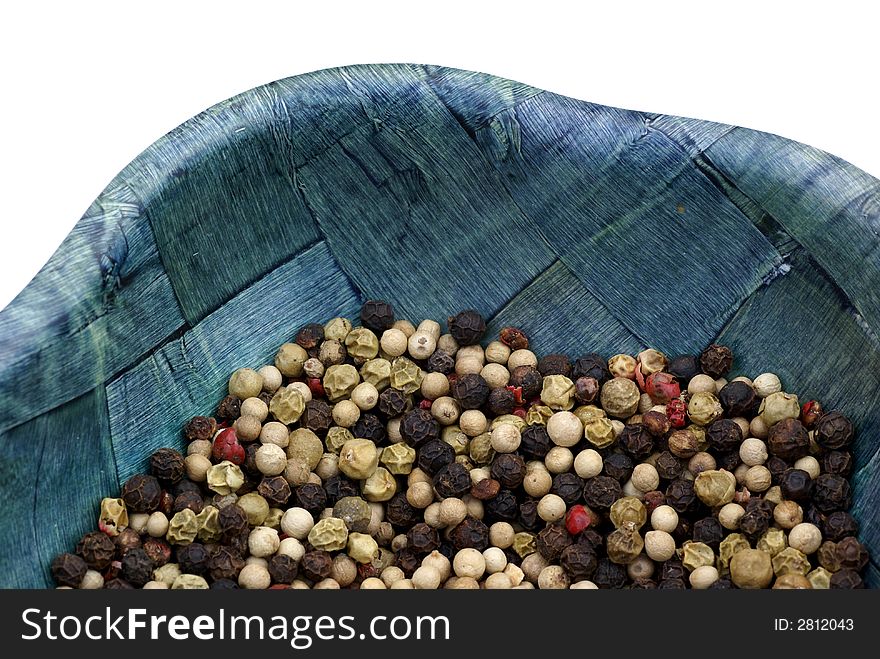 An isolated bowl of peppercorns. An isolated bowl of peppercorns.
