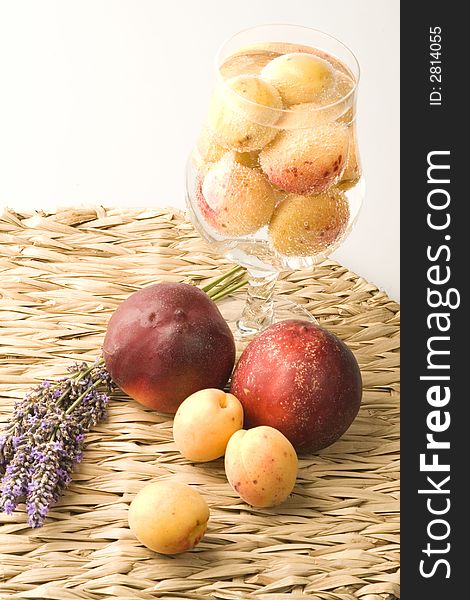 Peaches and apricots on the table with lavender. Peaches and apricots on the table with lavender
