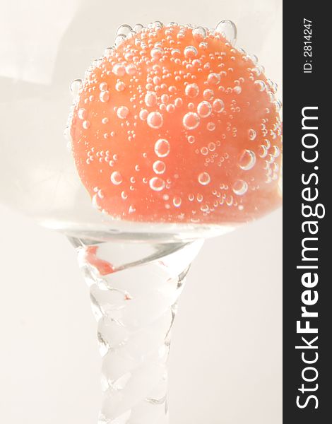 Red fresh tomato in water