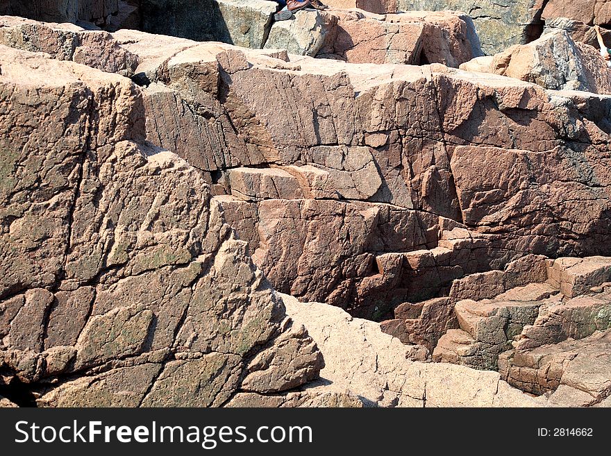 A pink granite wall in Acadia National Park. A pink granite wall in Acadia National Park