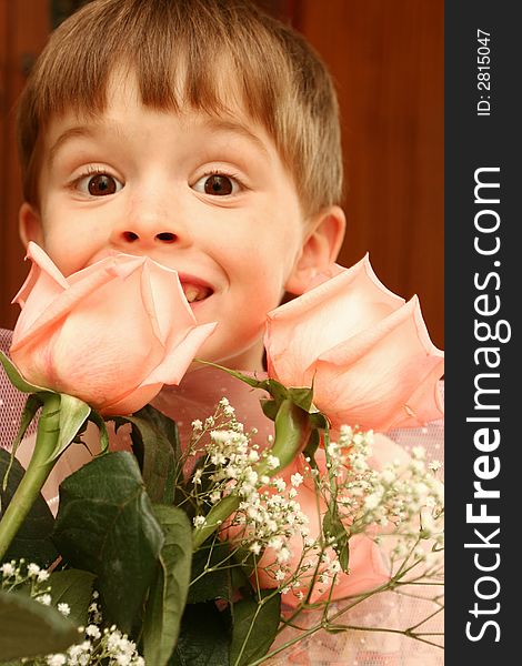 The nice boy and pink roses