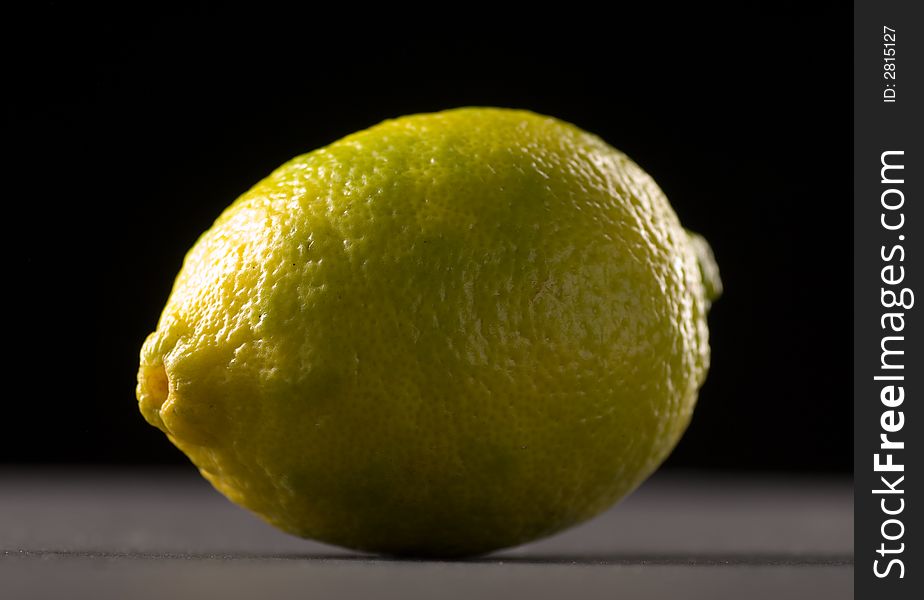Single lime with a black background