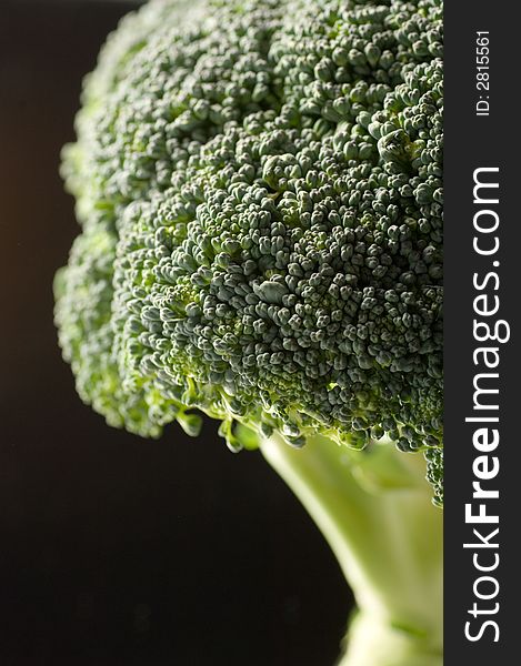 Broccoli close up on a black background