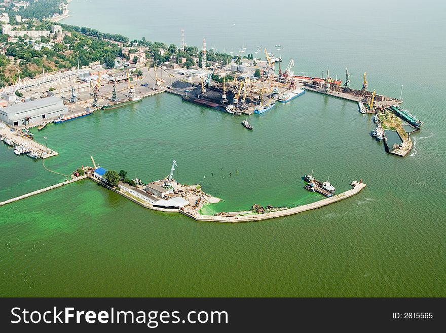 Photo of port with crane and blu sea