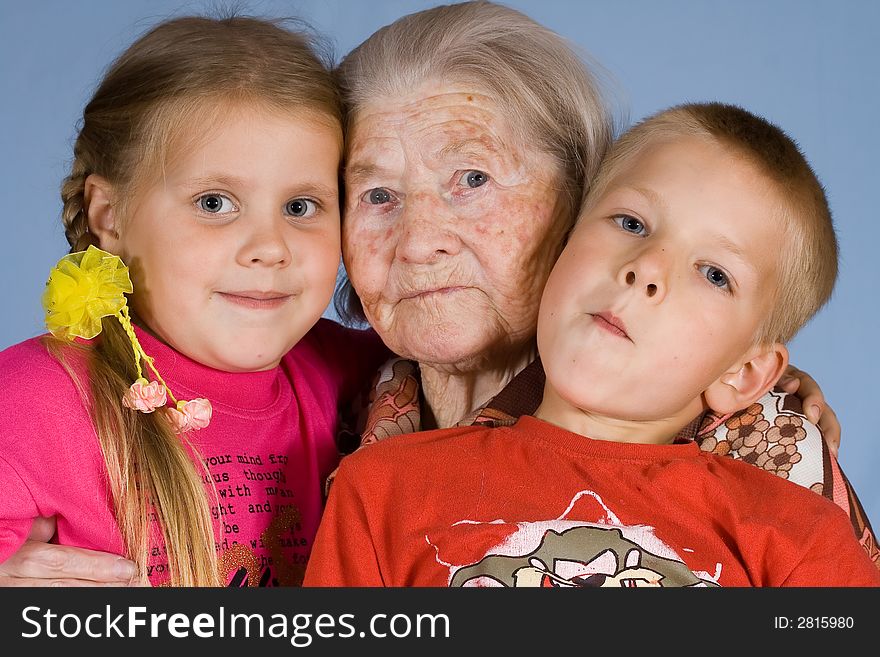 Happy grandsons sit with the grandmother. Happy grandsons sit with the grandmother