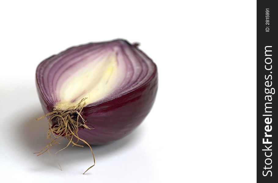 A red onion cut in half. A red onion cut in half.