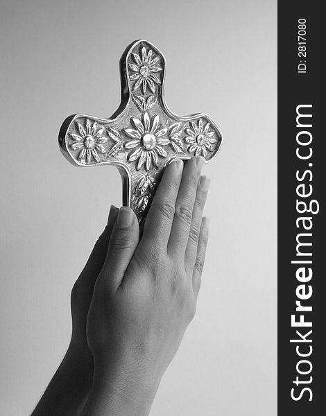 Hands holding cross in a worship way. Hands holding cross in a worship way