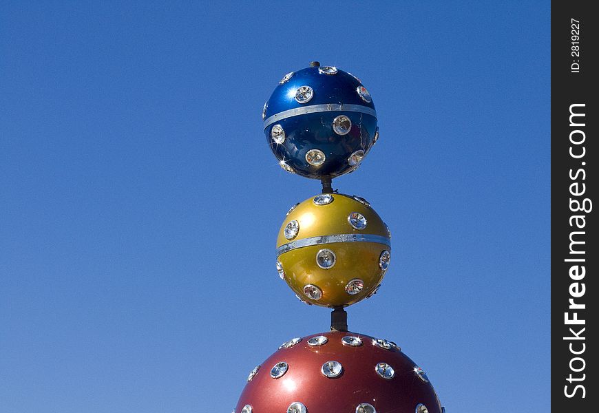 Colored balls with spotlights on a fairground in south france