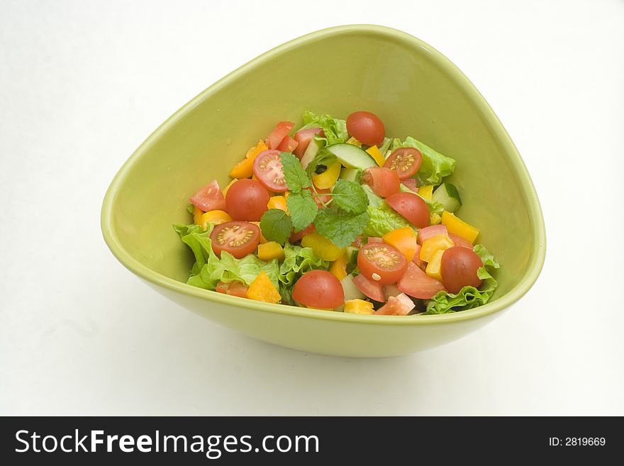 Fresh newly made salad in green bowl. Fresh newly made salad in green bowl