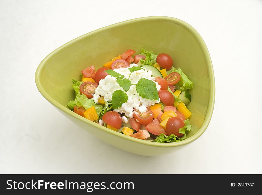 Fresh newly made salad with cottage cheese in green bowl. Fresh newly made salad with cottage cheese in green bowl