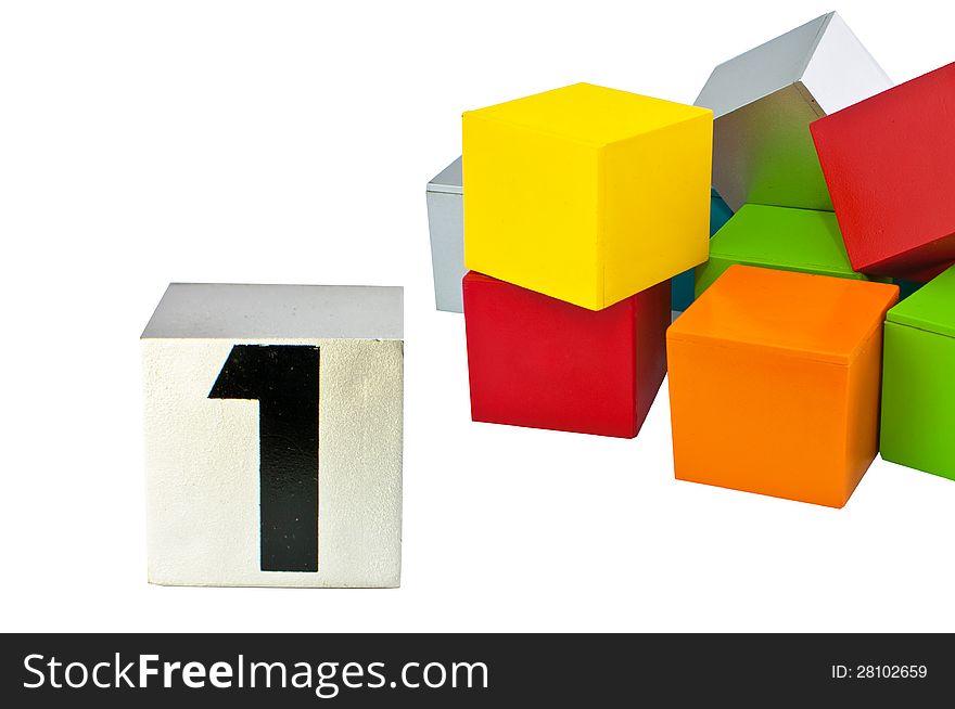 Number one on a cube standing before other colorful cubes