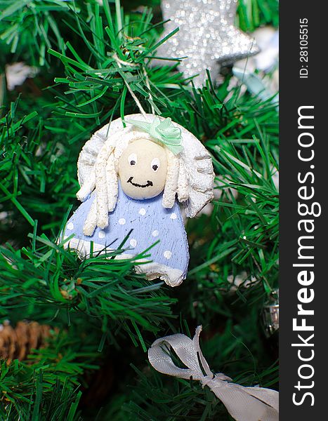 Funny decorative angel on xmas tree