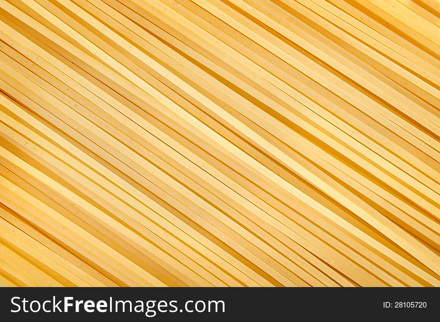 Photo of the yellow raw pasta background. Photo of the yellow raw pasta background