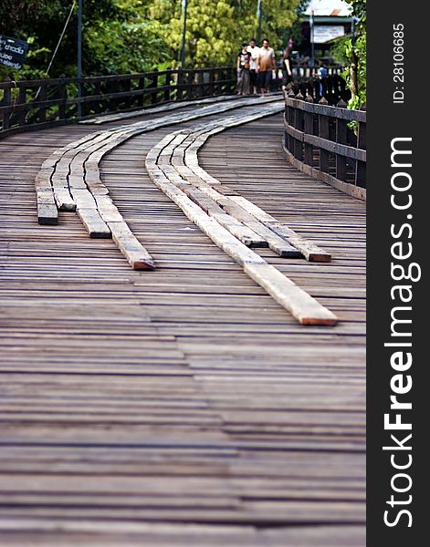 A walkway made by several wood planks. A walkway made by several wood planks