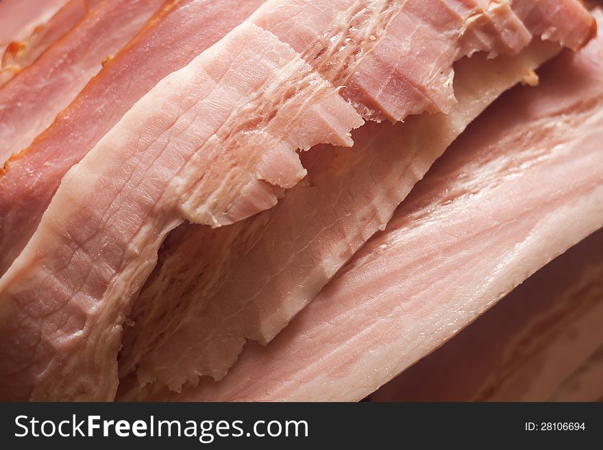 Closeup shot of a pile of tasty bacon slices