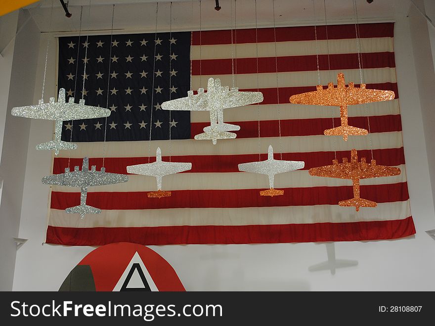 Vintage, historic, WW2 aircraft hanging from warehouse ceiling. Museum.