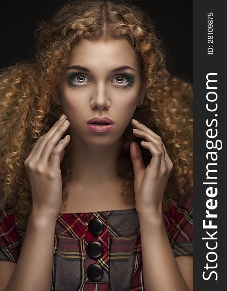 Portrait of young beautiful girl with curly red hair. Portrait of young beautiful girl with curly red hair