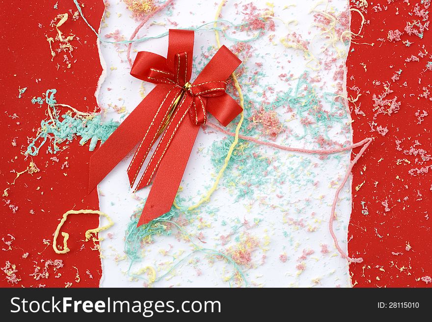 The red ribbon and paper ripped for christmas event. The red ribbon and paper ripped for christmas event