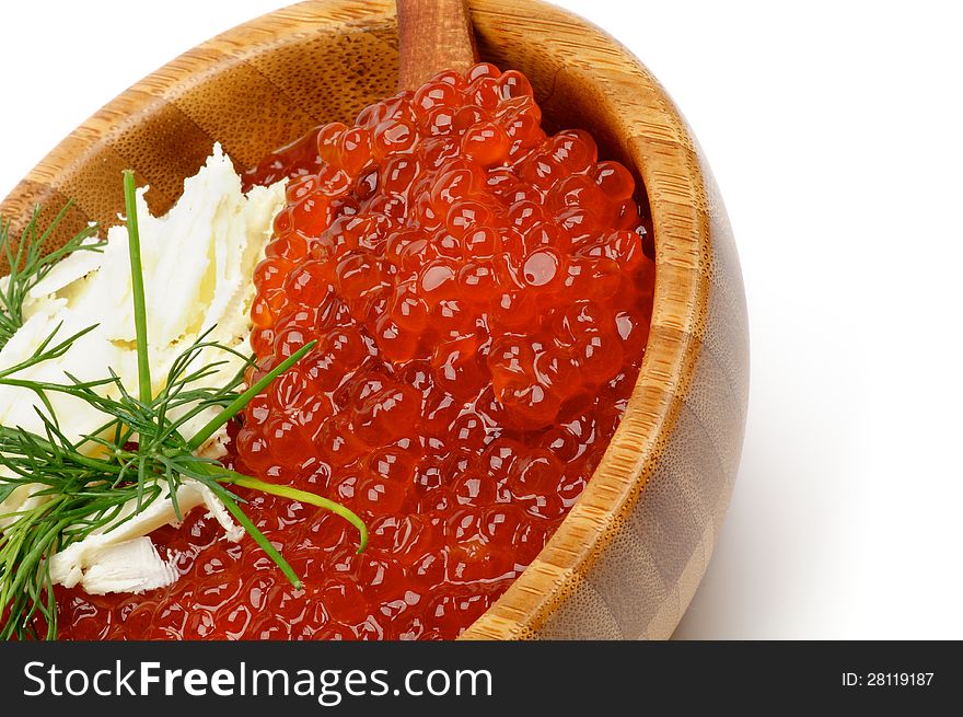 Perfect Red Caviar with Butter and Dill in Wood Bowl closeup on white background