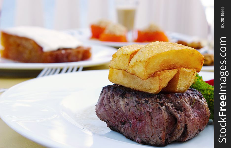 Grilled beef steak on potato