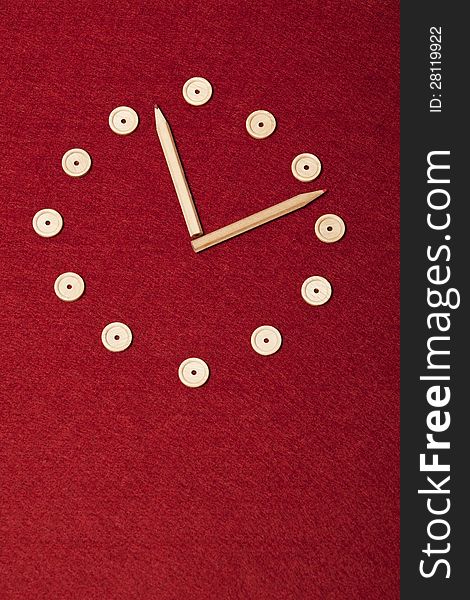 Simple Hand Made Clock On Red Background