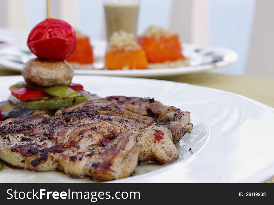 Grilled chicken breasts and vegetables