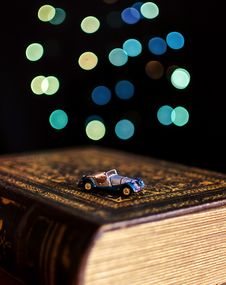 Old Book And Miniature Car Royalty Free Stock Photos