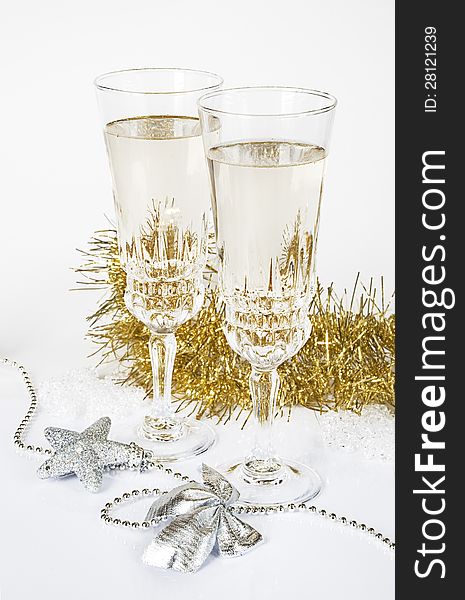 Two glasses of champagne on a white background