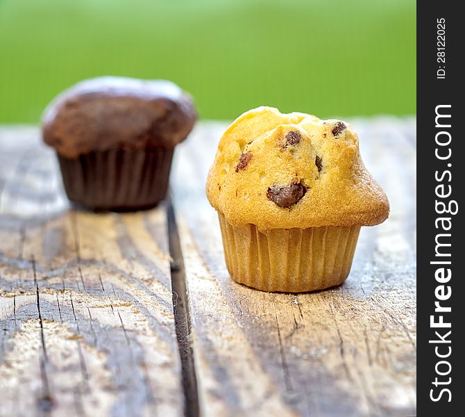 Chocolate chip muffin on old wooden table. Chocolate chip muffin on old wooden table